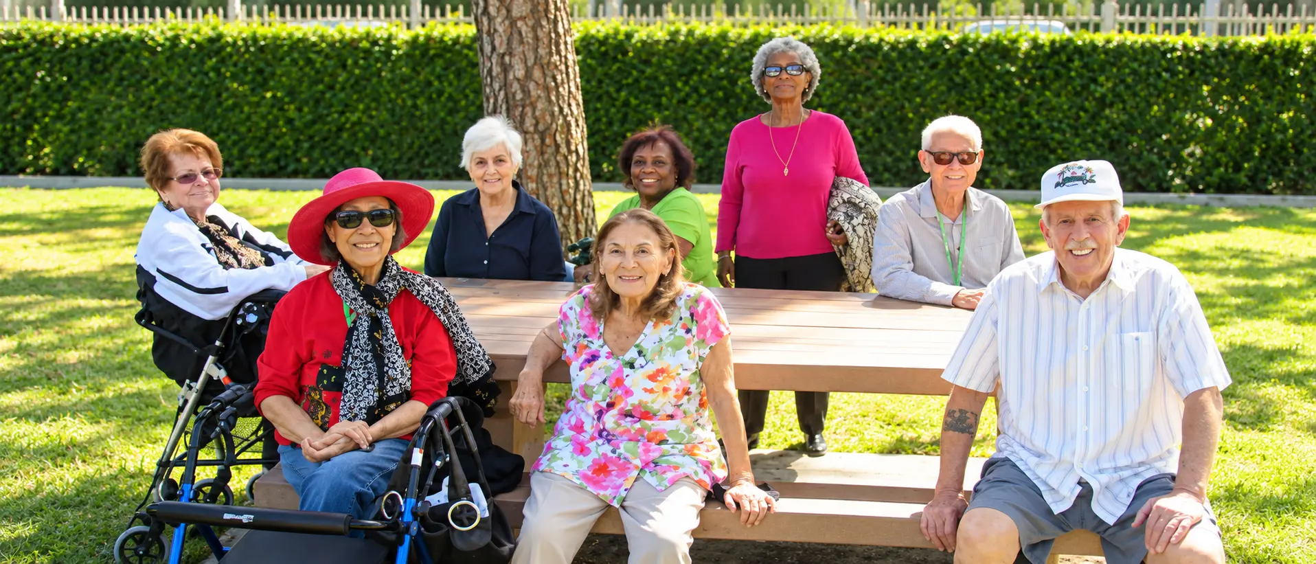 Residents gathered at an outdoor picnic table