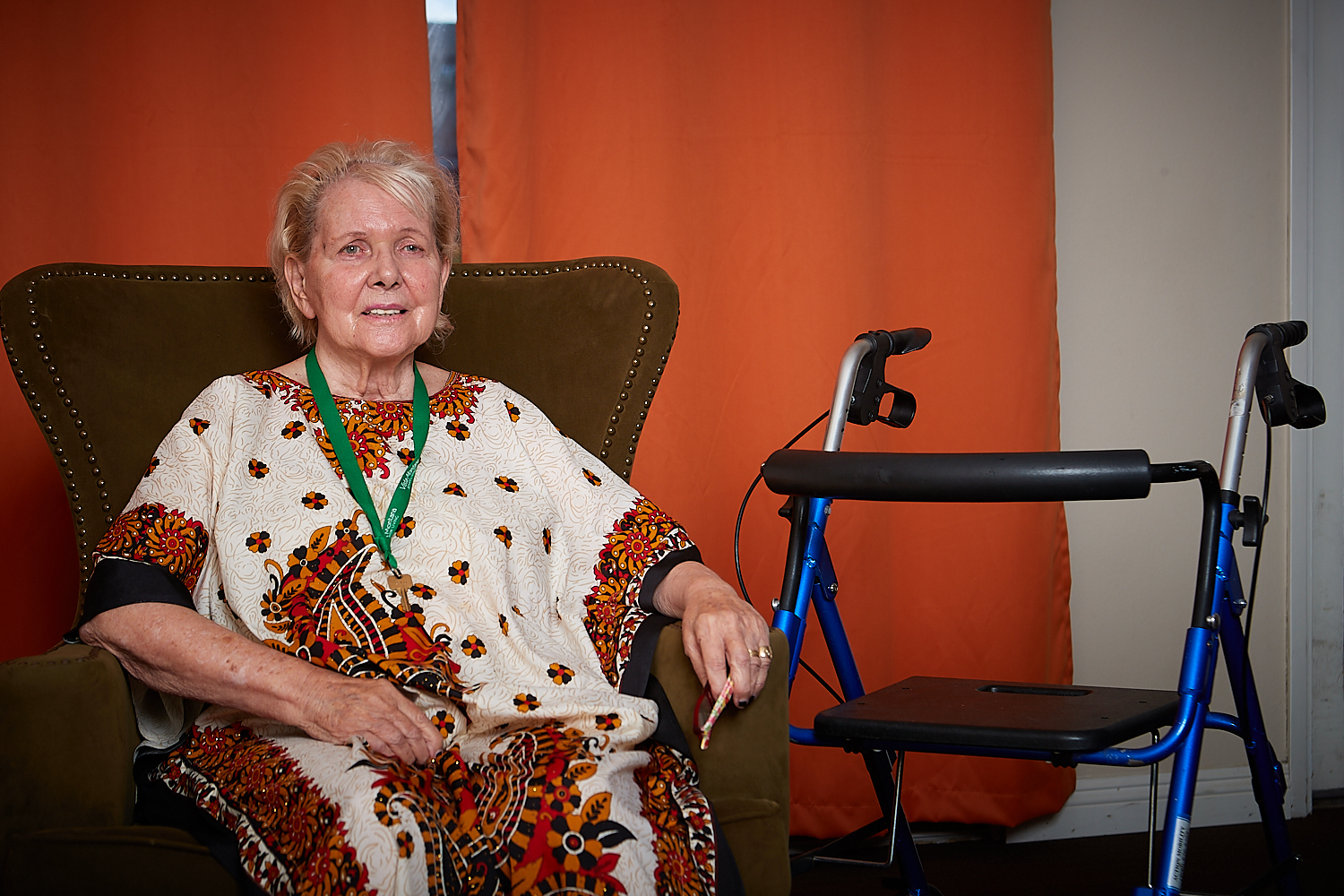 Resident relaxing in an armchair