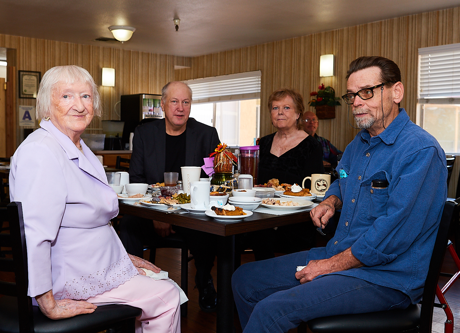Residents sharing a holiday meal in the dining room